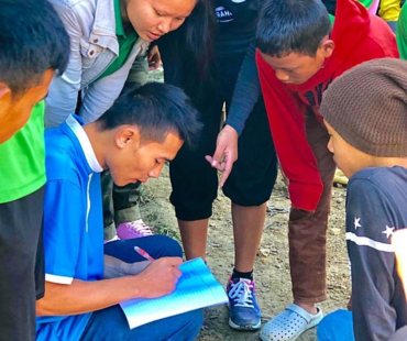 Team planning their strategy at Sports Day